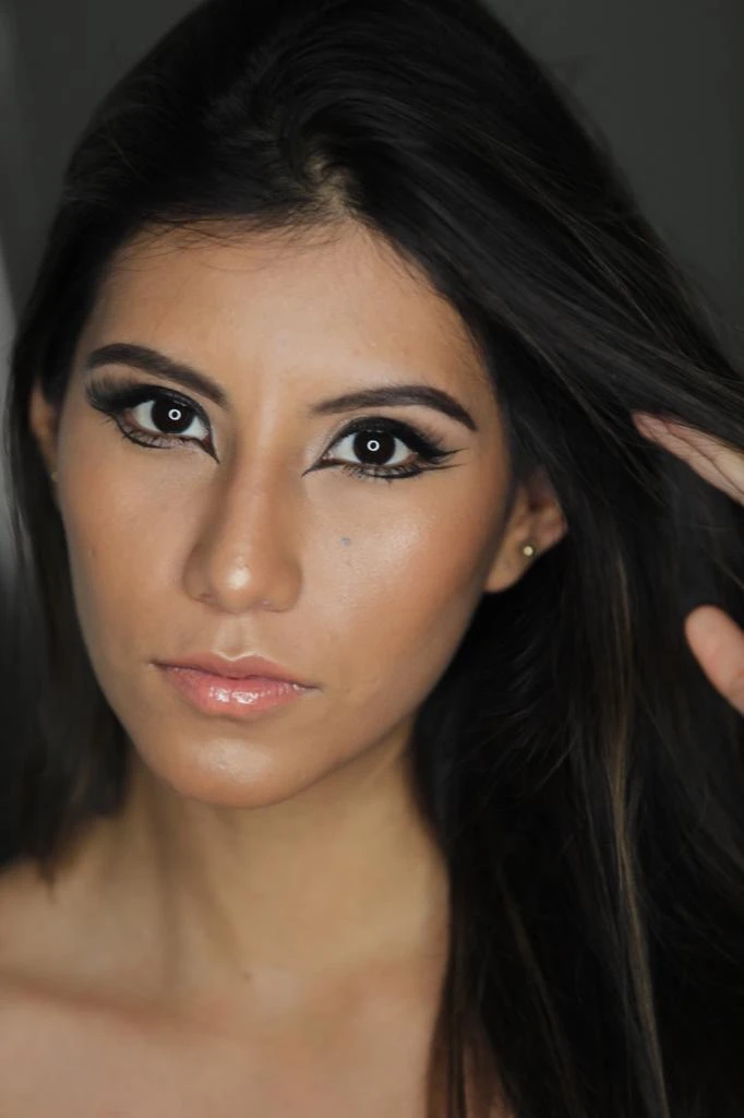 Editorial beauty portrait of Millen Guerrero with graphic eye makeup