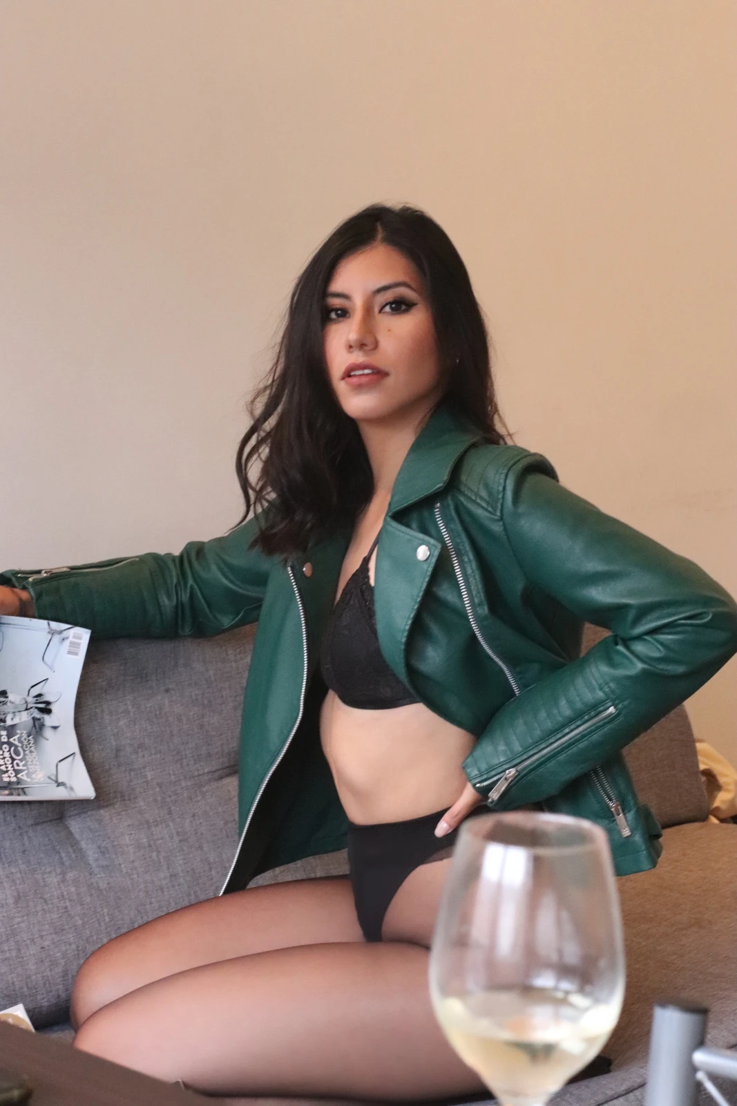Millen Guerrero wearing a leather jacket in a relaxed editorial portrait