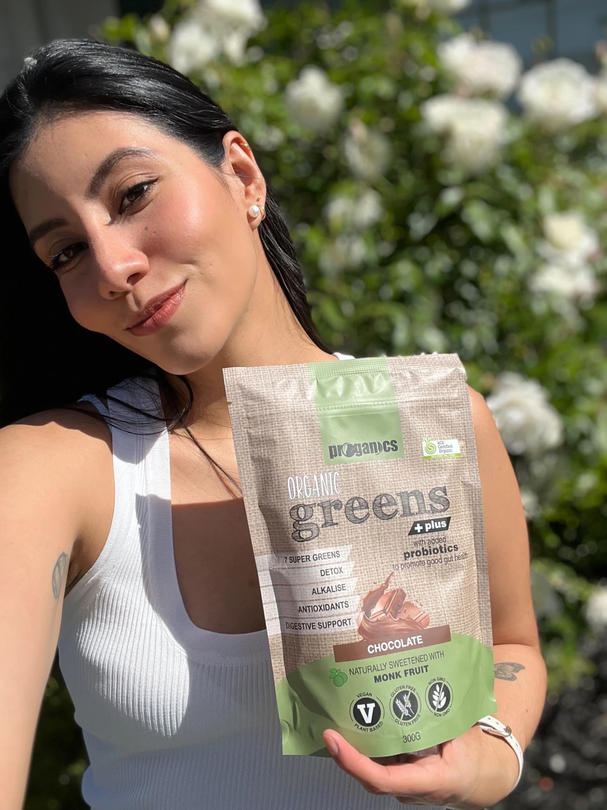 Millen Guerrero creating UGC content with a wellness greens product